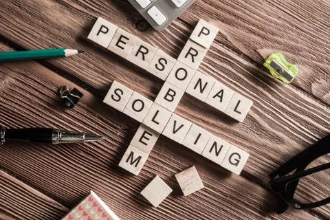 Conceptual business keywords on table with elements of game making crossword Stock Photos