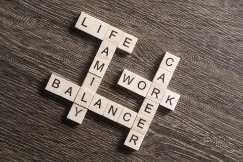 Conceptual business keywords on table with elements of game making crossword Foto stock