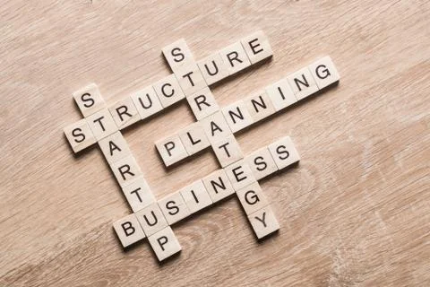 Conceptual business keywords on table with elements of game making crossword Foto stock