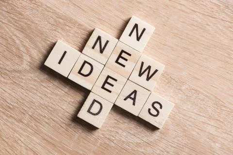 Conceptual business keywords on table with elements of game making crossword Stock Photos