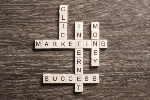 Conceptual business keywords on table with elements of game making crossword Stockfoto's
