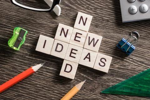 Conceptual business keywords on table with elements of game making crossword Stockfoto's
