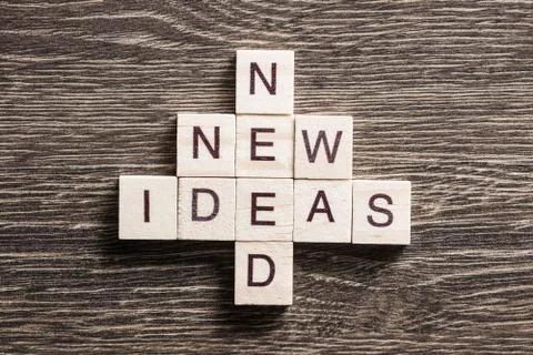 Conceptual business keywords on table with elements of game making crossword Stock Photos