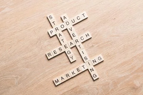 Conceptual business keywords on table with elements of game making crossword Stock Photos