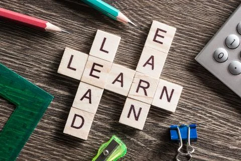 Conceptual business keywords on table with elements of game making crossword Foto stock