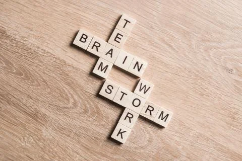 Conceptual business keywords on table with elements of game making crossword Stock Photos