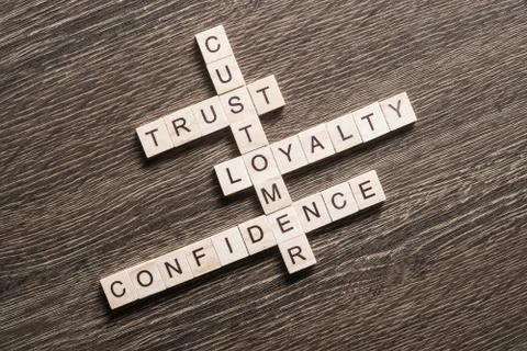 Conceptual business keywords on table with elements of game making crossword Foto stock