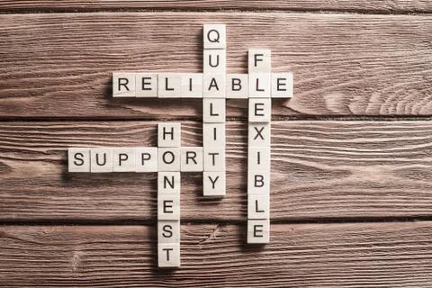 Conceptual business keywords on table with elements of game making crossword Stock Photos