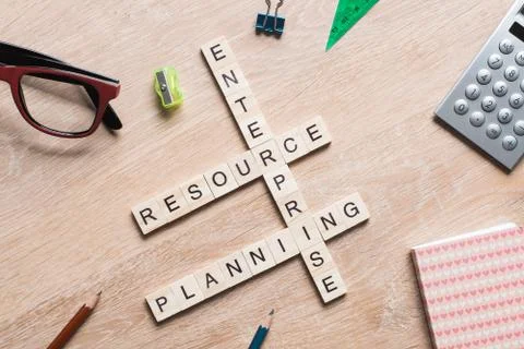 Conceptual business keywords on table with elements of game making crossword Stock Photos