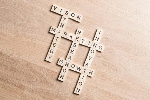 Conceptual business keywords on table with elements of game making crossword Stock Photos