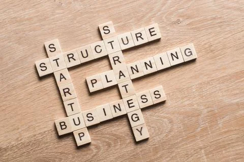 Conceptual business keywords on table with elements of game making crossword 스톡 사진