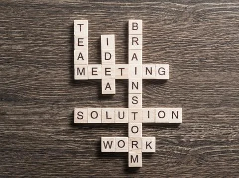 Conceptual business keywords on table with elements of game making crossword Foto stock