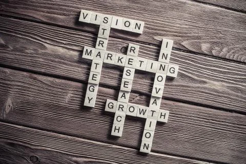 Conceptual business keywords on table with elements of game maki Stock Photos