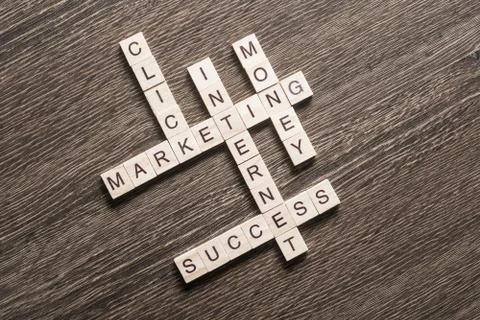 Conceptual business keywords on table with elements of game making crossword Stockfoto's