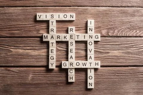 Conceptual business keywords on table with elements of game making crossword Stock Photos
