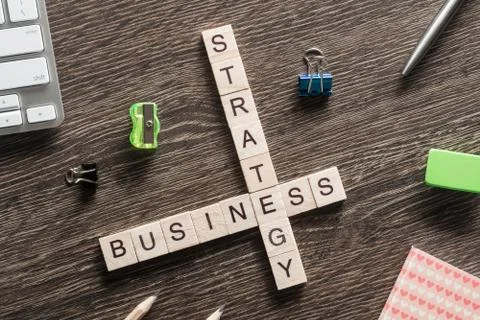 Conceptual business keywords on table with elements of game making crossword Stockfoto's