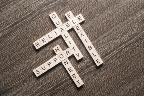 Conceptual business keywords on table with elements of game making crossword Stock Photos