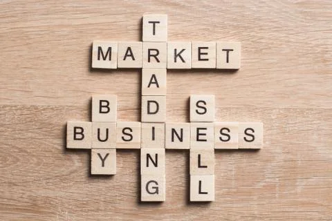 Conceptual business keywords on table with elements of game making crossword Stock Photos