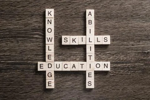 Conceptual business keywords on table with elements of game making crossword Stockfoto's