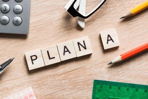 Conceptual business keywords on table with elements of game making crossword Stock Photos