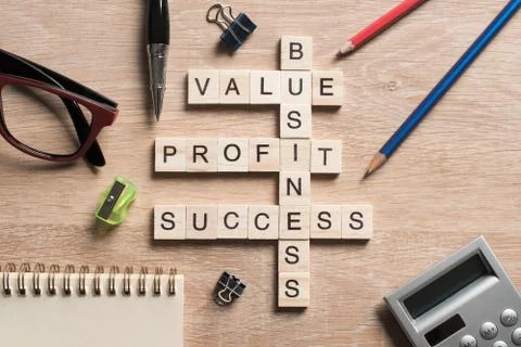 Conceptual business keywords on table with elements of game making crossword Stock Photos