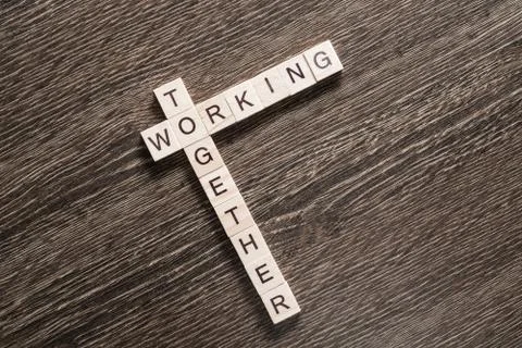 Conceptual business keywords on table with elements of game making crossword Stock Photos