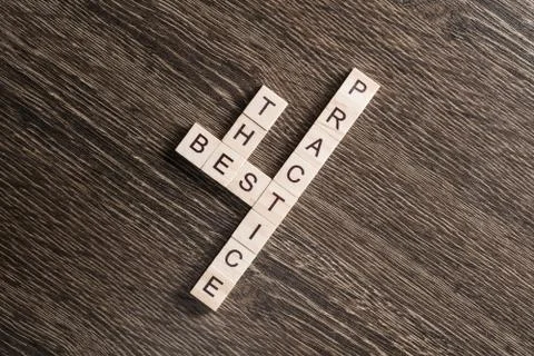 Conceptual business keywords on table with elements of game making crossword Stock Photos