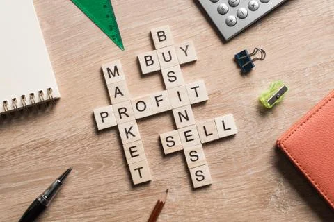 Conceptual business keywords on table with elements of game making crossword 스톡 사진