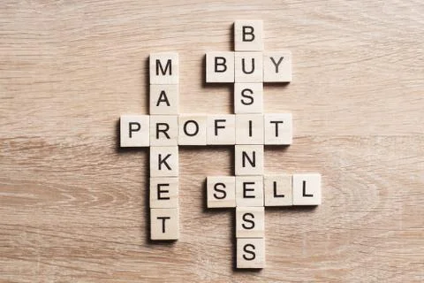 Conceptual business keywords on table with elements of game making crossword 스톡 사진