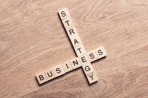 Conceptual business keywords on table with elements of game maki Stock Photos