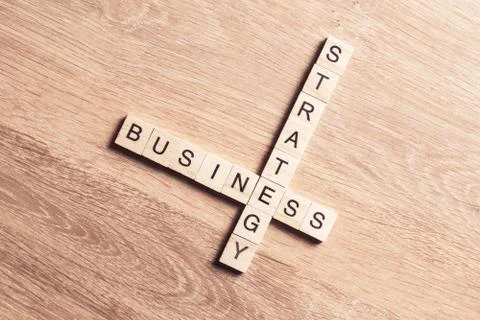 Conceptual business keywords on table with elements of game maki Stock Photos