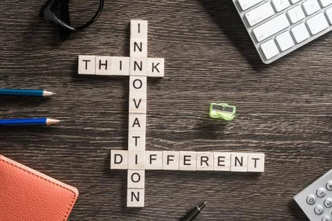 Conceptual business keywords on table with elements of game making crossword Stockfoto's
