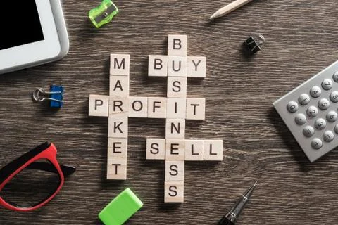 Conceptual business keywords on table with elements of game making crossword Stockfoto's