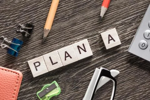 Conceptual business keywords on table with elements of game making crossword Stockfoto's