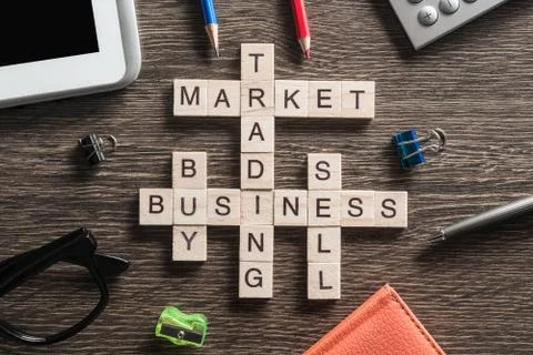 Conceptual business keywords on table with elements of game making crossword Stock Photos