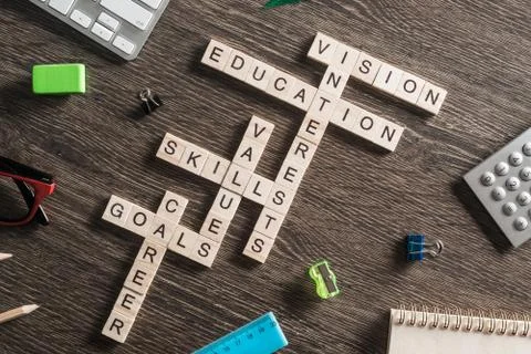 Conceptual business keywords on table with elements of game making crossword Stock Photos