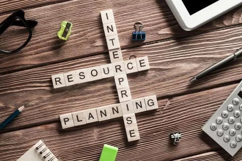 Conceptual business keywords on table with elements of game making crossword Stock Photos