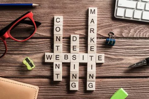 Conceptual business keywords on table with elements of game making crossword 스톡 사진