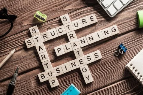 Conceptual business keywords on table with elements of game making crossword Stock Photos
