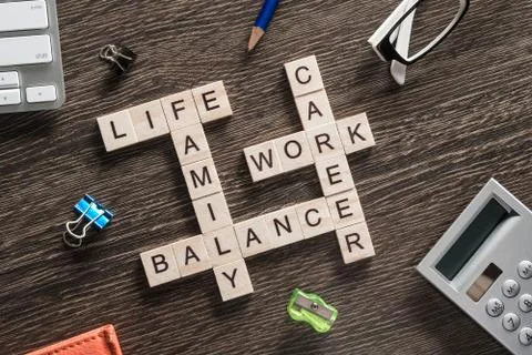 Conceptual business keywords on table with elements of game making crossword Foto stock
