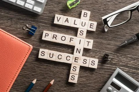 Conceptual business keywords on table with elements of game making crossword Stock Photos