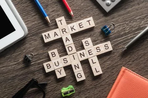 Conceptual business keywords on table with elements of game making crossword Foto stock