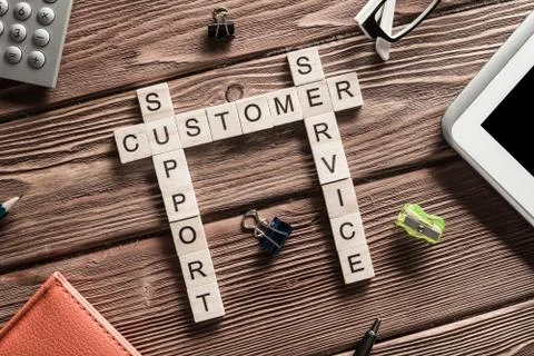 Conceptual business keywords on table with elements of game making crossword Stock Photos