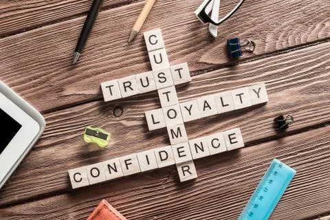 Conceptual business keywords on table with elements of game making crossword Stock Photos