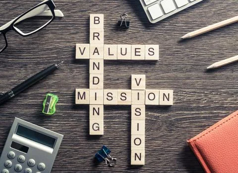 Conceptual business keywords on table with elements of game making crossword Foto stock