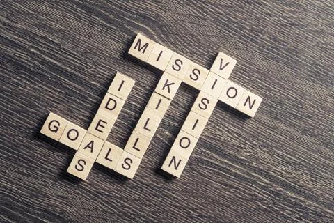 Conceptual business keywords on table with elements of game making crossword Stock Photos