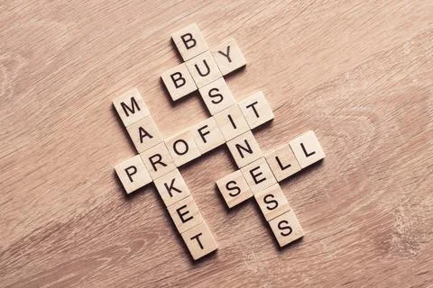 Conceptual business keywords on table with elements of game making crossword Stock Photos