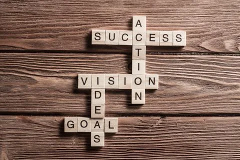 Conceptual business keywords on table with elements of game making crossword Stock Photos