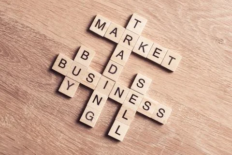 Conceptual business keywords on table with elements of game making crossword Stock Photos