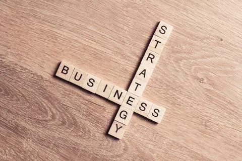 Conceptual business keywords on table with elements of game making crossword Stock Photos